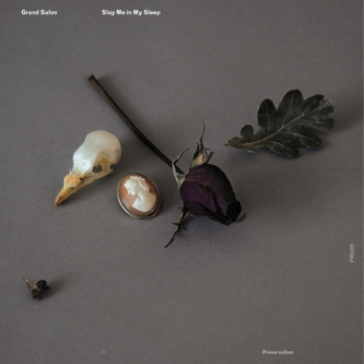 He Raises Her Gently Into a Chair. She Tells Him How to Make a Sling for Her Arm Using a Tea Towel. As He Works She Marvels At His Face.